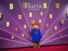 Tapete vermelho Bafta em fotos: vestidos lindos, ternos estilosos e um casaco