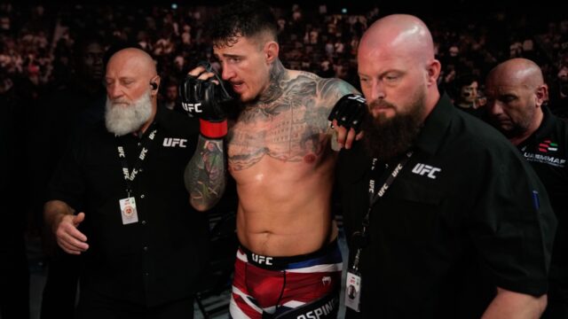 UFC-heavyweight-champion-Tom-Aspinall-helped-out-of-cage-after-eye-injury.jpg